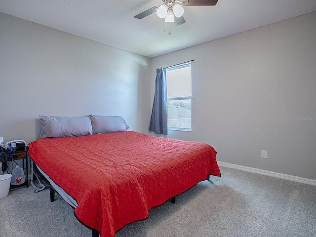 bedroom featuring ceiling fan and carpet floors