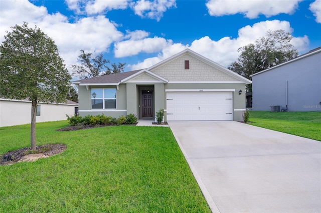 view of front of house featuring a front yard, central AC, and a garage