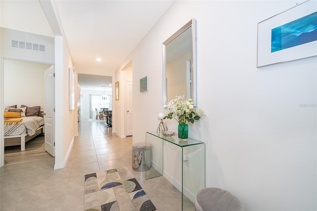 hallway featuring light tile patterned flooring