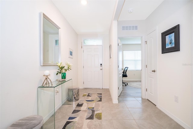 foyer featuring light tile patterned floors