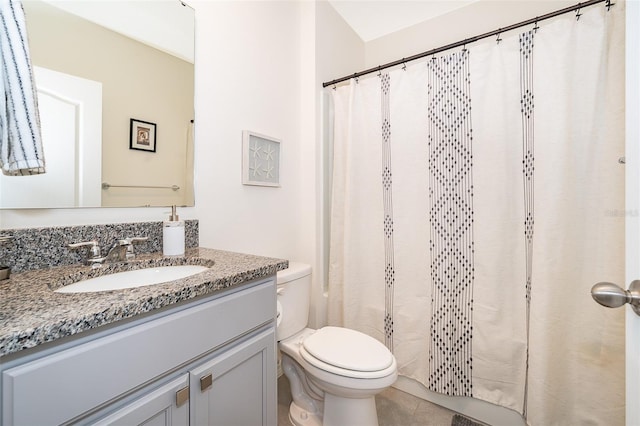 bathroom with vanity, a shower with curtain, toilet, and tile patterned flooring