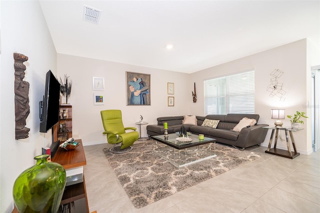 living room with light tile patterned flooring