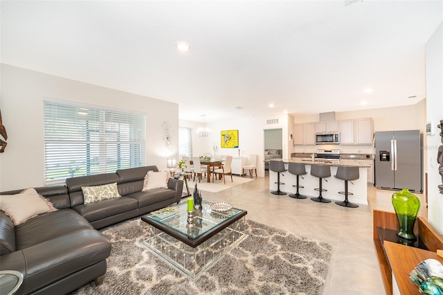 living room with light tile patterned flooring