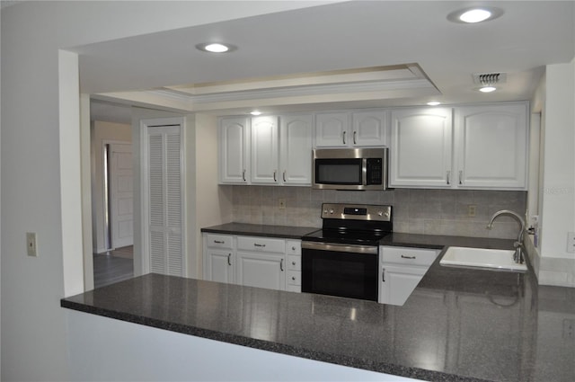 kitchen with sink, white cabinetry, and stainless steel appliances