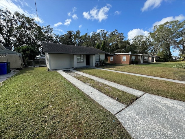 ranch-style house with a front lawn