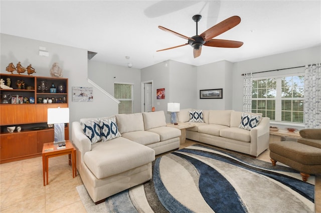 tiled living room featuring ceiling fan