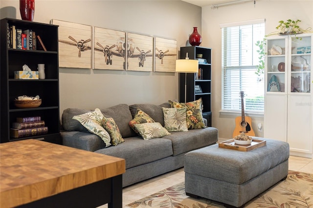 living area featuring tile patterned floors and healthy amount of natural light