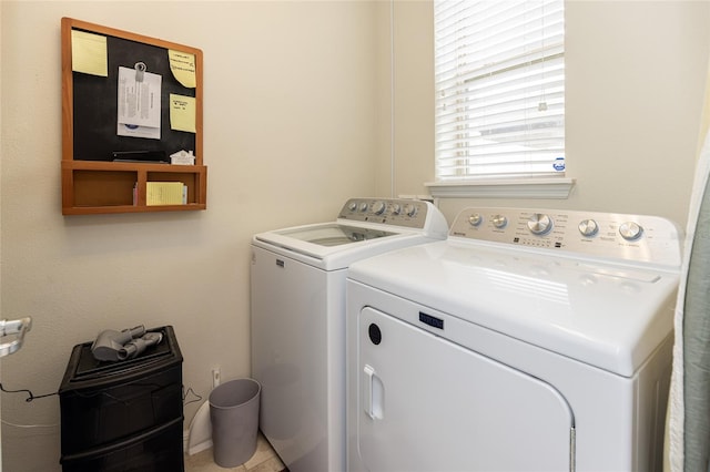 laundry room featuring washing machine and clothes dryer