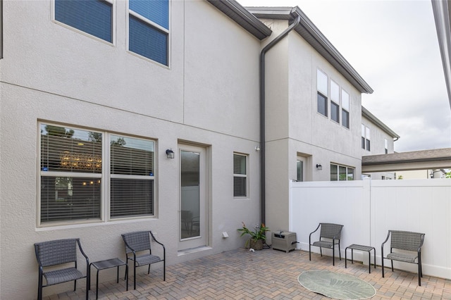 view of patio / terrace featuring fence