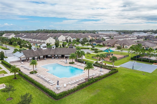 community pool with a residential view