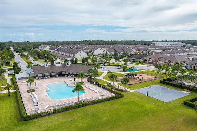 aerial perspective of suburban area featuring a pool area