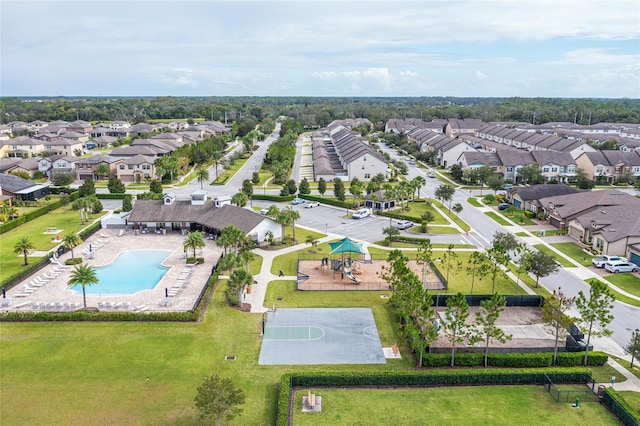 aerial perspective of suburban area featuring a pool area