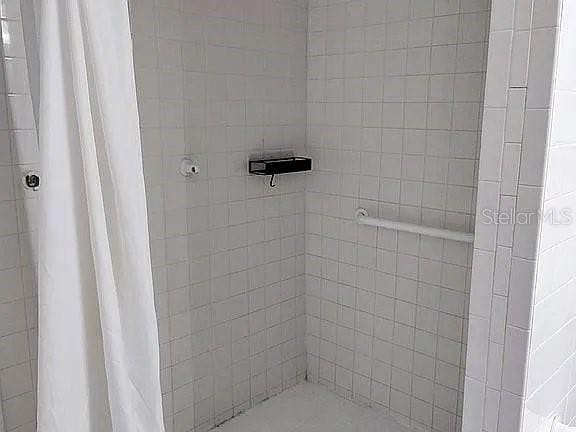 bathroom with a shower with shower curtain