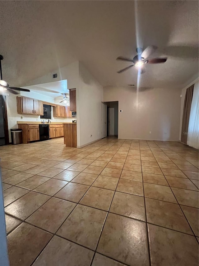 unfurnished living room with light tile patterned flooring and lofted ceiling