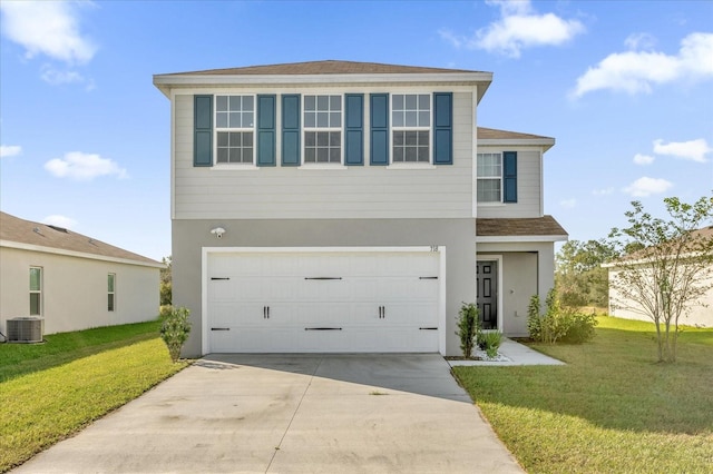 view of front of home featuring central AC unit, a front yard, and a garage