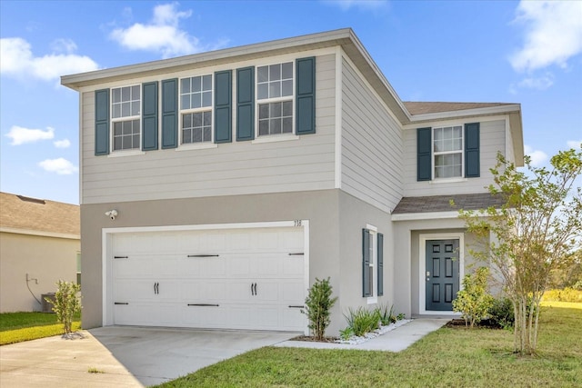 view of front of house with a front lawn and a garage