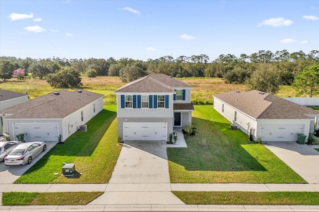 view of front of home featuring cooling unit and a front yard