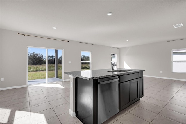 kitchen with dishwasher, sink, an island with sink, and plenty of natural light