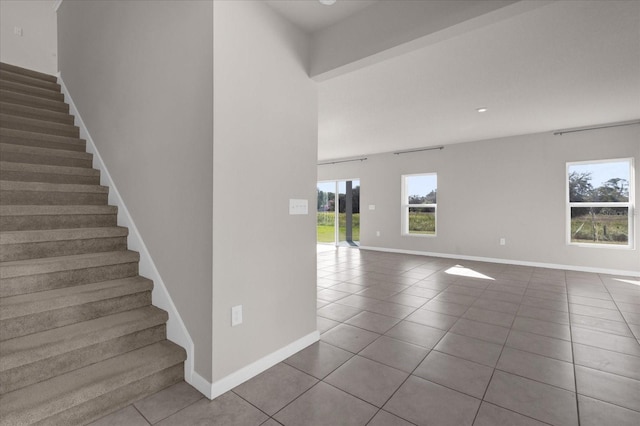 staircase with tile patterned floors