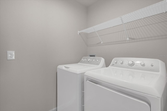 laundry room featuring separate washer and dryer