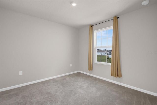 empty room with carpet flooring