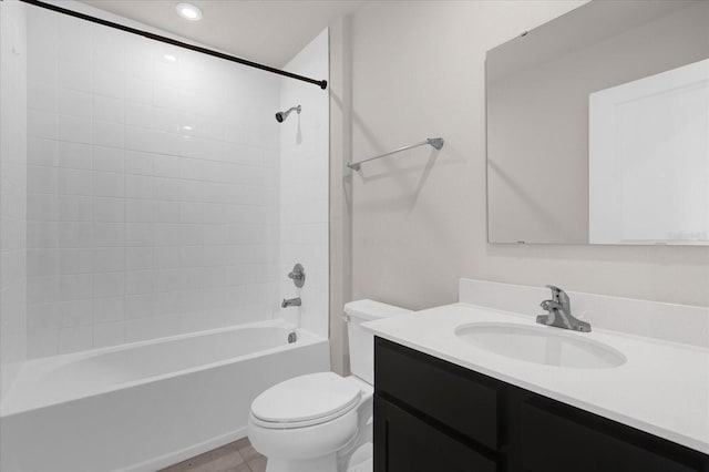 full bathroom with vanity, toilet, and tiled shower / bath