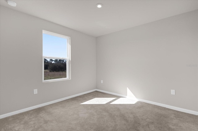 empty room with light colored carpet