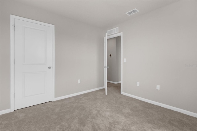 unfurnished bedroom with light carpet