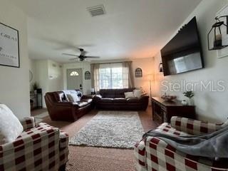 living room with ceiling fan