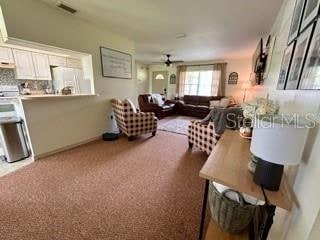 living room featuring ceiling fan