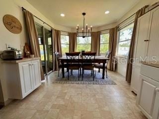 dining area featuring a notable chandelier