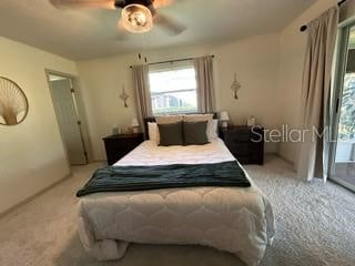 bedroom with light carpet and ceiling fan