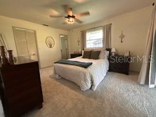 bedroom featuring ceiling fan and light colored carpet