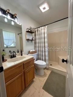 bathroom with toilet, a shower with curtain, and vanity