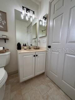 bathroom with vanity and toilet