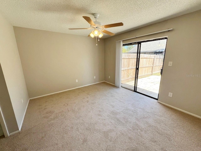 unfurnished room with a textured ceiling, light colored carpet, and ceiling fan