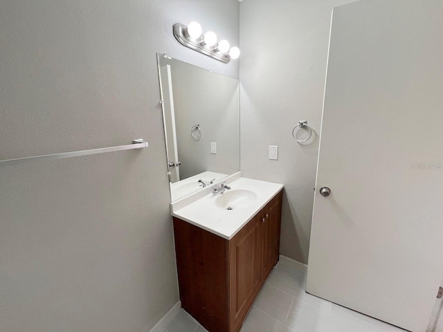 bathroom with vanity and tile patterned floors