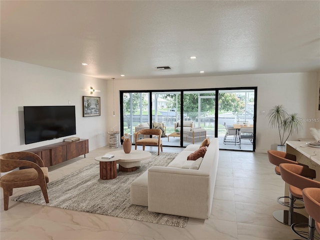 living room featuring a textured ceiling