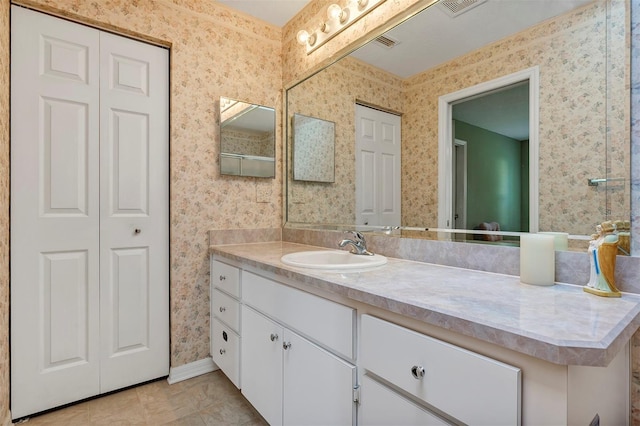 bathroom featuring vanity and tile patterned flooring