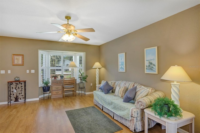 living room with ceiling fan and light wood-type flooring