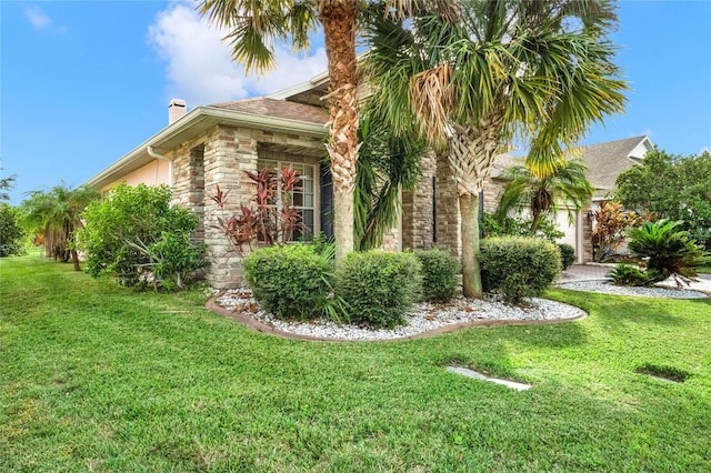 view of side of property featuring a yard