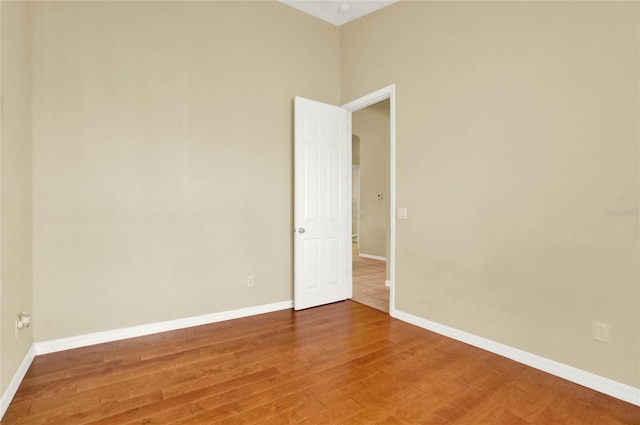 spare room with hardwood / wood-style floors