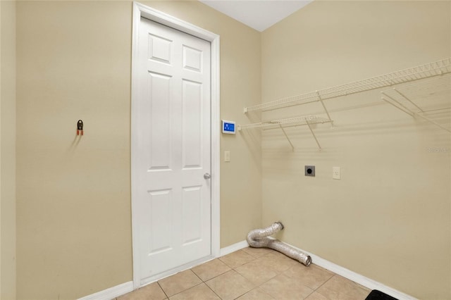 laundry room with light tile patterned floors and hookup for an electric dryer