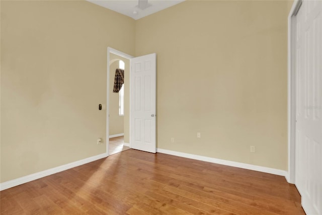 empty room with hardwood / wood-style flooring