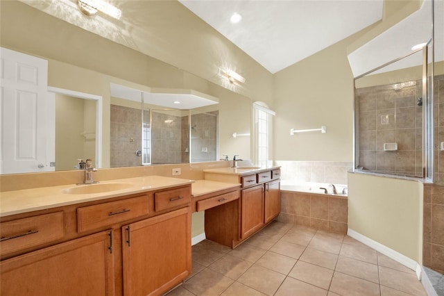 bathroom with vanity, tile patterned flooring, and shower with separate bathtub