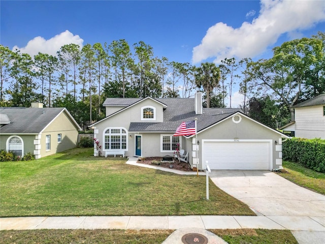 view of front facade with a garage and a front lawn