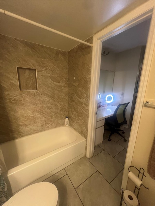 full bath with tile patterned flooring, shower / bath combination, and toilet