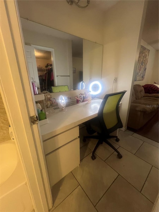 office space with light tile patterned floors