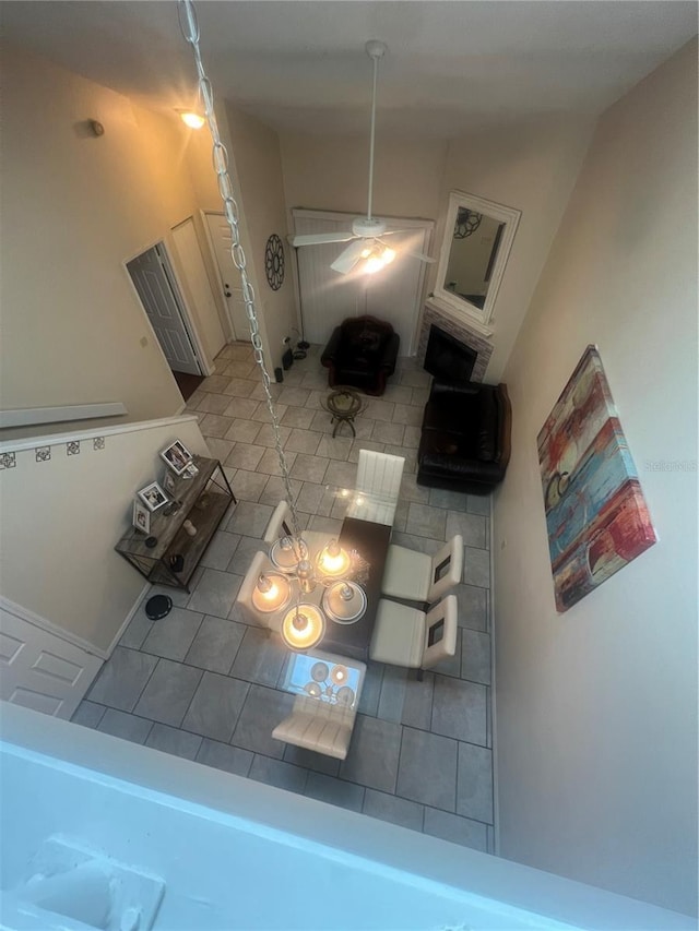 unfurnished living room with ceiling fan