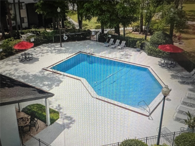 view of swimming pool featuring a patio area